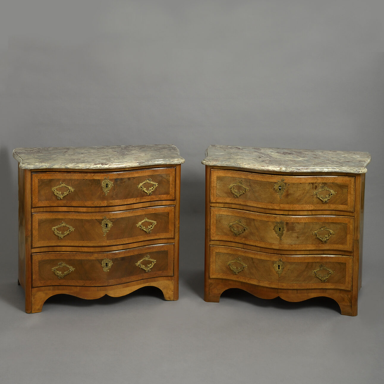 |pair of 18th century Bavarian marble-topped walnut-veneered commodes