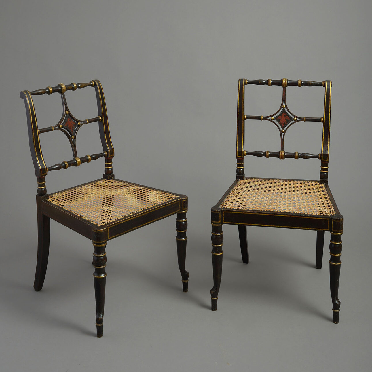 Pair of George III japanned chairs in the manner of Chippendale the younger