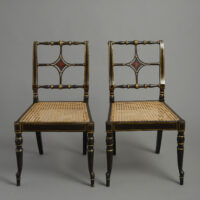Pair of George III japanned chairs in the manner of Chippendale the Younger